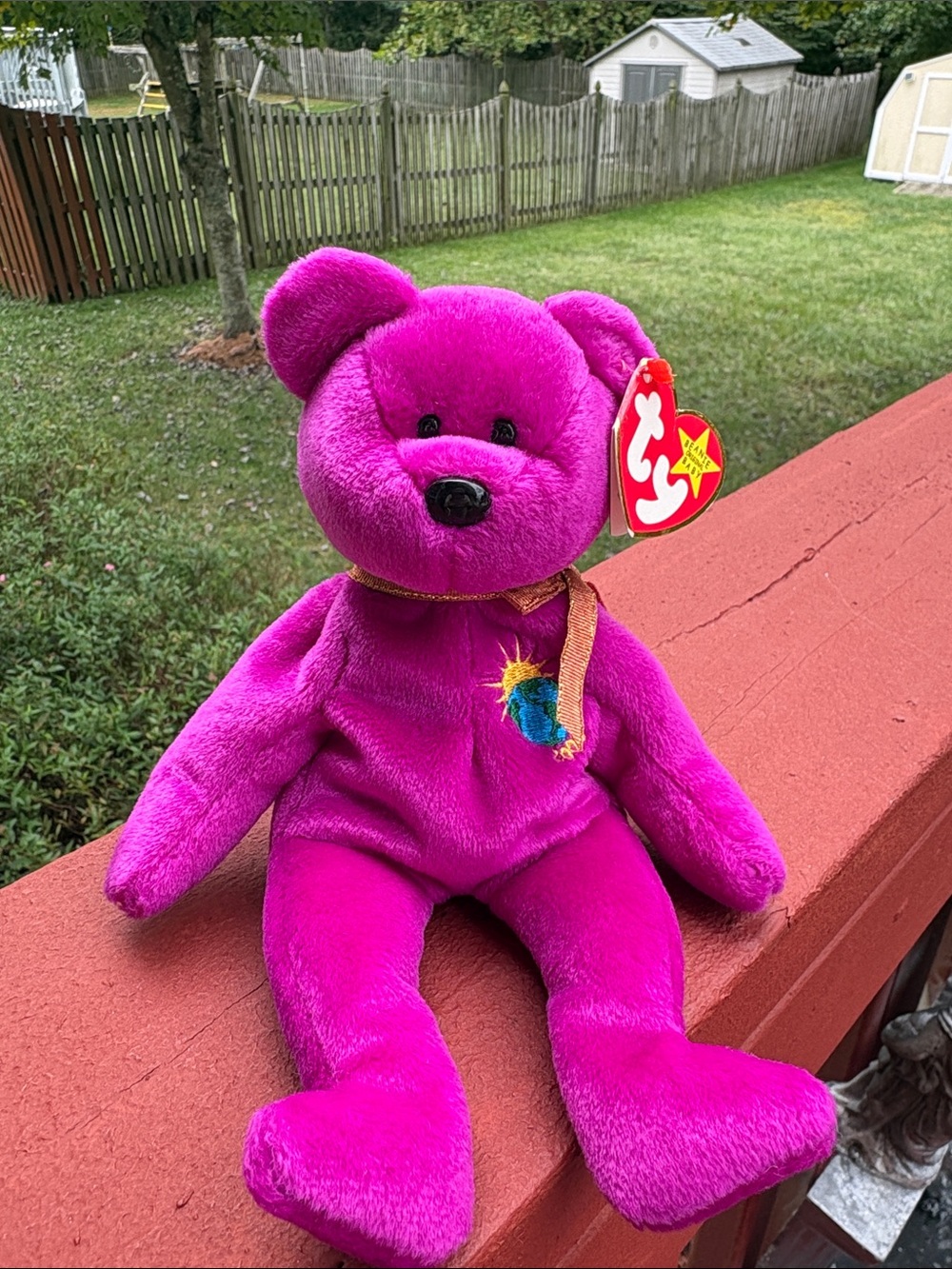 Millennium the Bear, a retired magenta Ty Beanie Baby